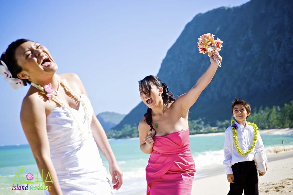 laughing as she catches the bouquet